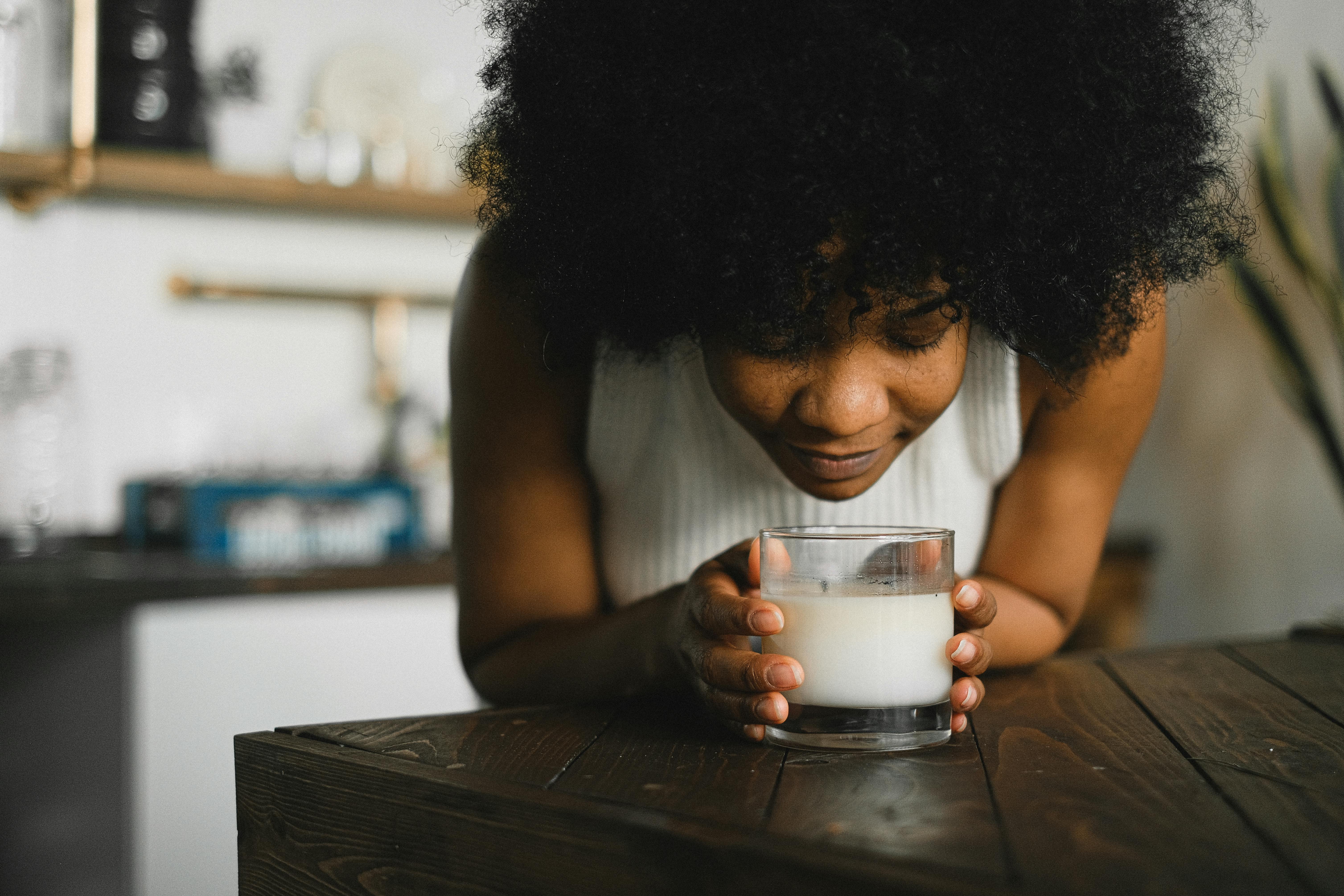 woman smelling a candle